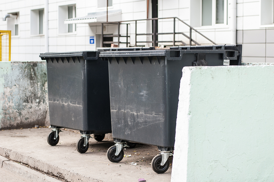 black garbage bins near housing